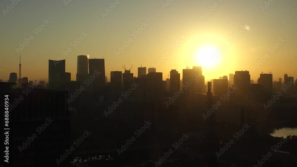 TOKYO, JAPAN - NOV 2023 : Aerial high angle view of cityscape of Tokyo and Mount Fuji in sunset. View of office buildings around Tokyo station and Nagatacho area. 4K time lapse shot, day to night. TOKYO, JAPAN - NOV 2023 : Aerial high angle view of cityscape of Tokyo and Mount Fuji in sunset. View of office buildings around Tokyo station and Nagatacho area. 4K time lapse shot, day to night.