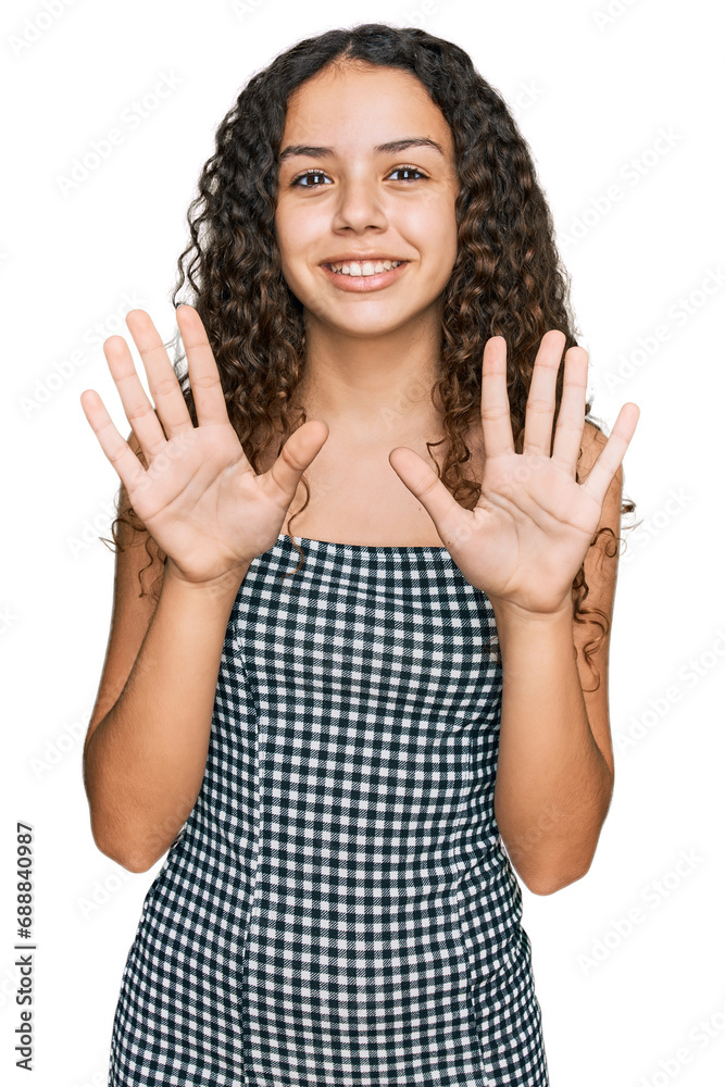 Teenager hispanic girl wearing casual clothes showing and pointing up with fingers number ten while smiling confident and happy. Teenager hispanic girl wearing casual clothes showing and pointing up with fingers number ten while smiling confident and happy.