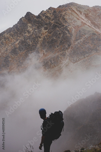 Climber in the cloudy landscape in Tatra mountains