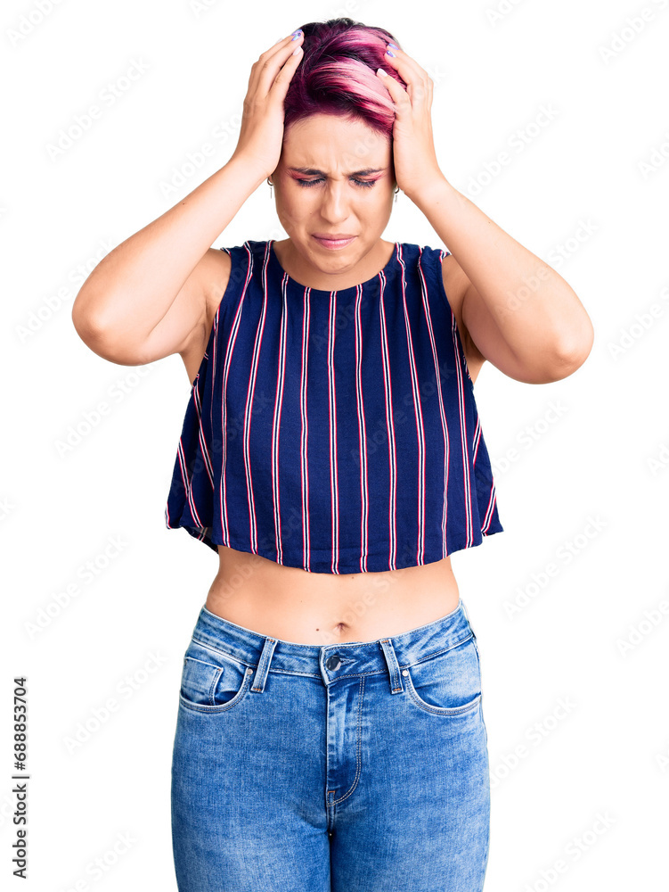 Young beautiful woman with pink hair wearing casual clothes suffering from headache desperate and stressed because pain and migraine. hands on head. Young beautiful woman with pink hair wearing casual clothes suffering from headache desperate and stressed because pain and migraine. hands on head.
