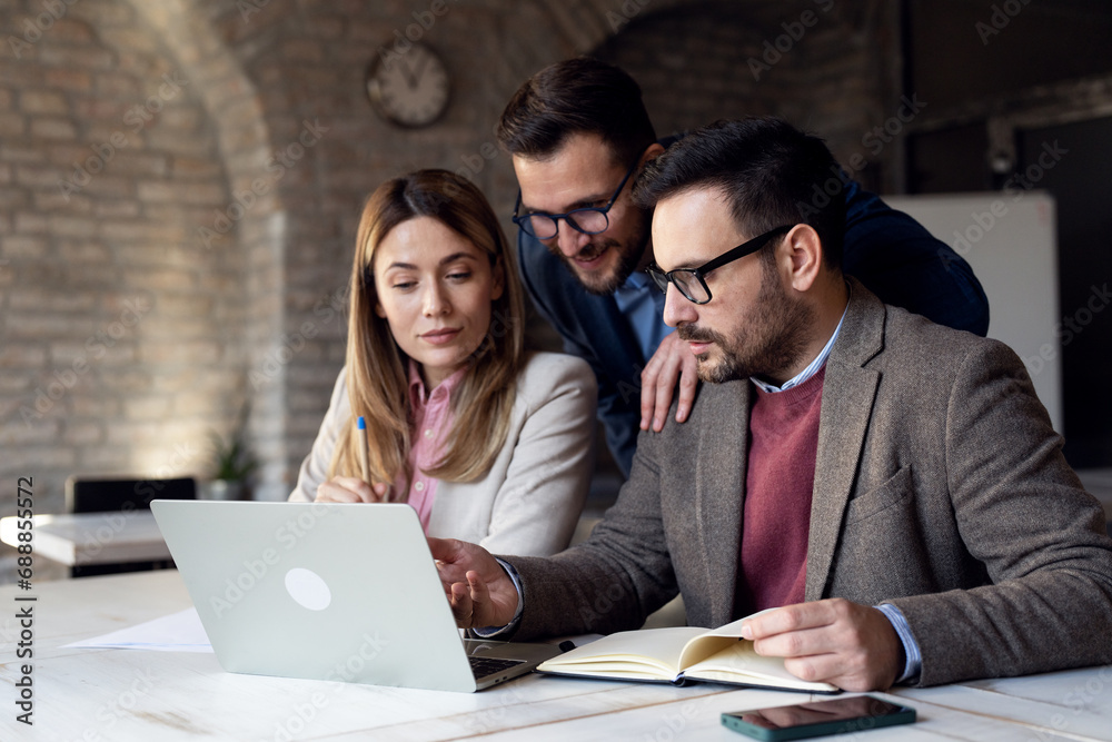 Fototapeta premium Coworkers working together at new project