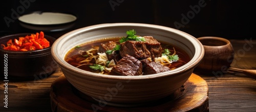 Served in a bowl, soup with beef ribs.