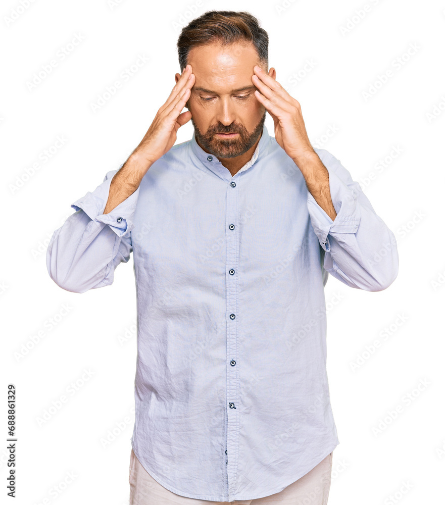 Handsome middle age man wearing business shirt with hand on head for pain in head because stress. suffering migraine.
