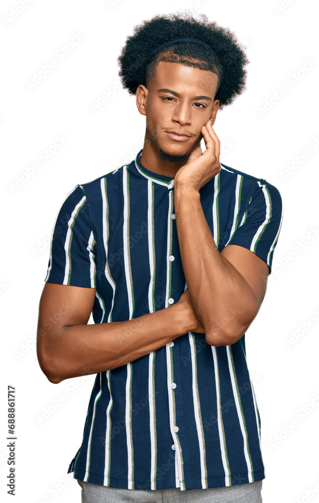 African american man with afro hair wearing casual clothes thinking looking tired and bored with depression problems with crossed arms. African american man with afro hair wearing casual clothes thinking looking tired and bored with depression problems with crossed arms.