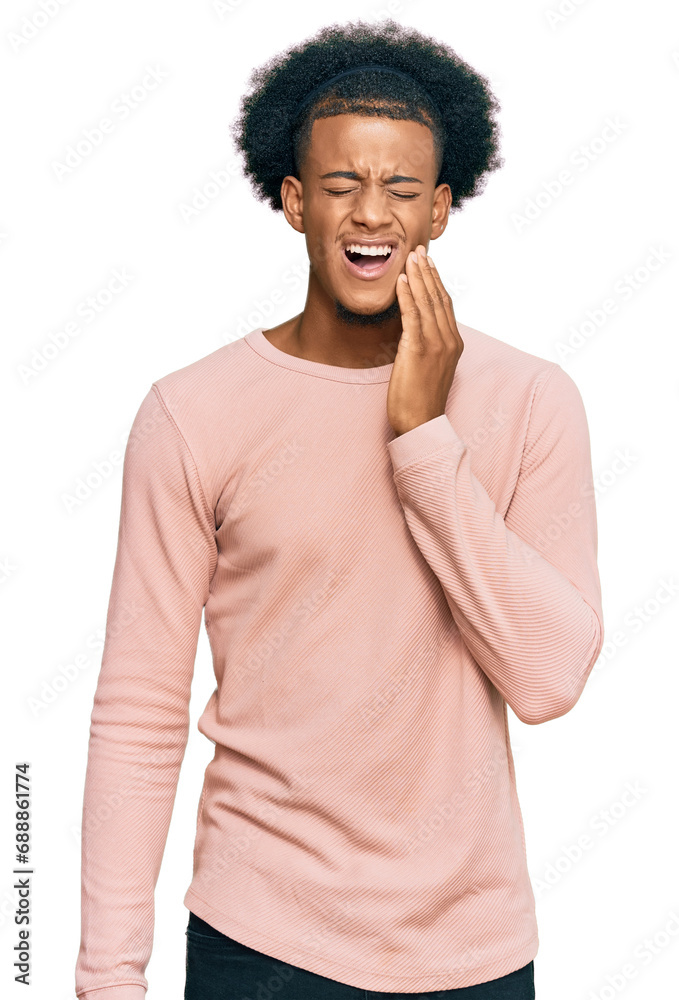 African american man with afro hair wearing casual clothes touching mouth with hand with painful expression because of toothache or dental illness on teeth. dentist African american man with afro hair wearing casual clothes touching mouth with hand with painful expression because of toothache or dental illness on teeth. dentist