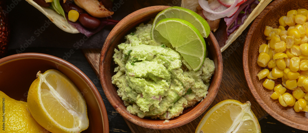 Tasty guacamole in bowl on table, closeup
