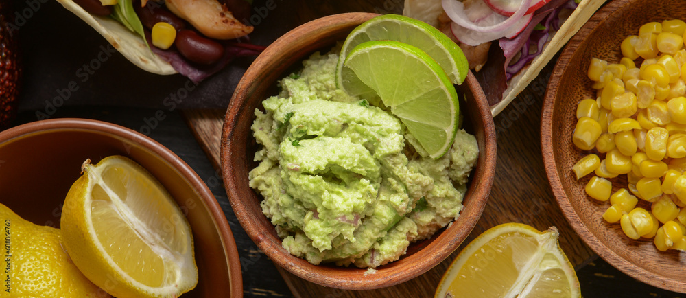 Tasty guacamole in bowl on table, closeup Tasty guacamole in bowl on table, closeup