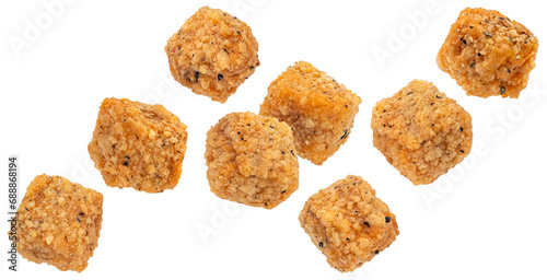 Deep fried breaded tofu cubes isolated on white background