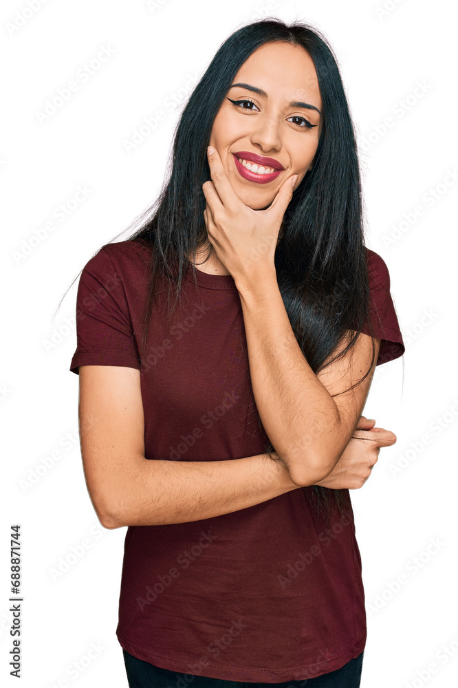 Young hispanic girl wearing casual t shirt looking confident at the camera smiling with crossed arms and hand raised on chin. thinking positive.