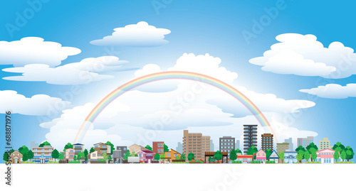 虹がかかった空と街並みのイラスト.