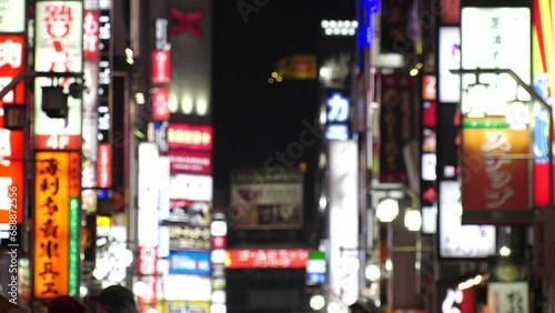 SHINJUKU, TOKYO, JAPAN - NOV 2023 : KABUKICHO downtown area at night. Colorful led neon street signs at entertainment district. Japanese urban nightlife and drinking concept video. Time lapse shot. photo