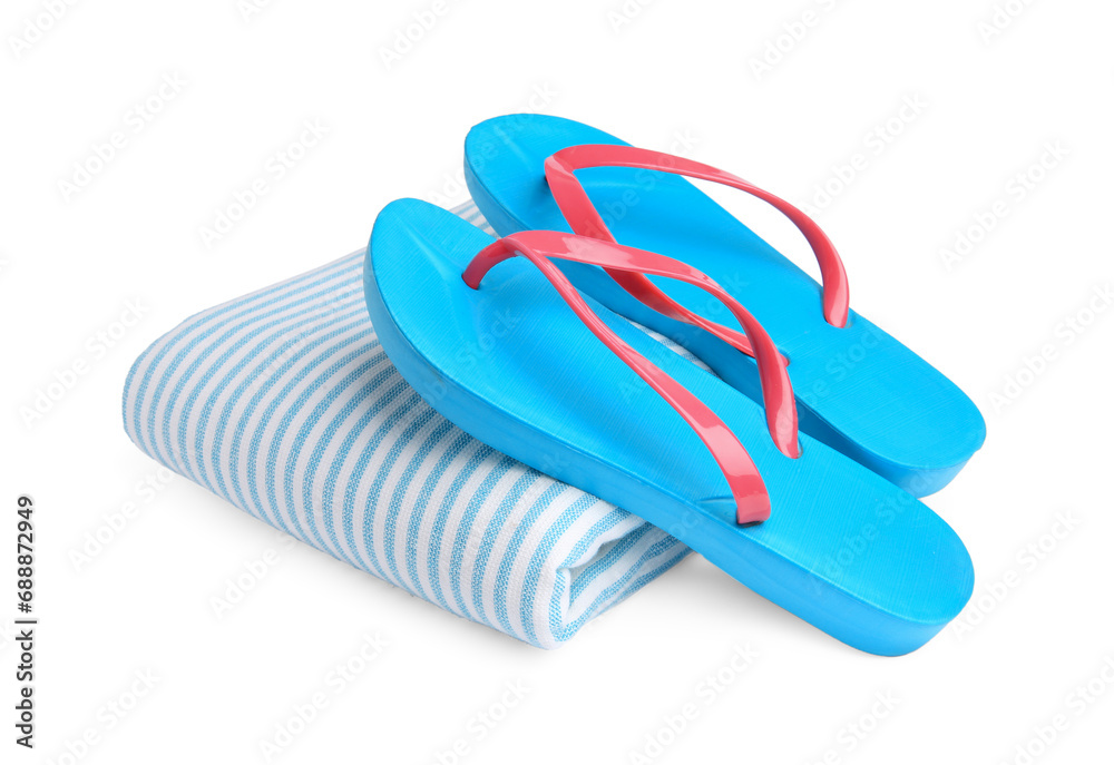 Stylish flip flops and beach towel isolated on white Stylish flip flops and beach towel isolated on white