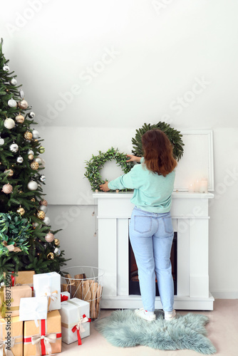 Young woman decorating fire...