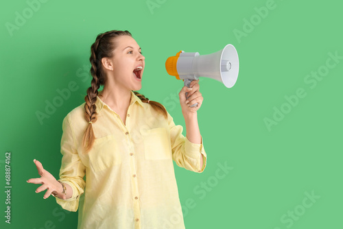 Young woman shouting into m...