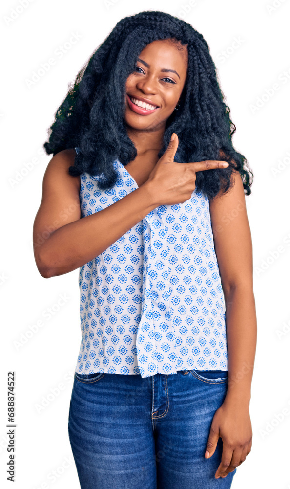 Beautiful african american woman wearing casual summer shirt cheerful with a smile of face pointing with hand and finger up to the side with happy and natural expression on face