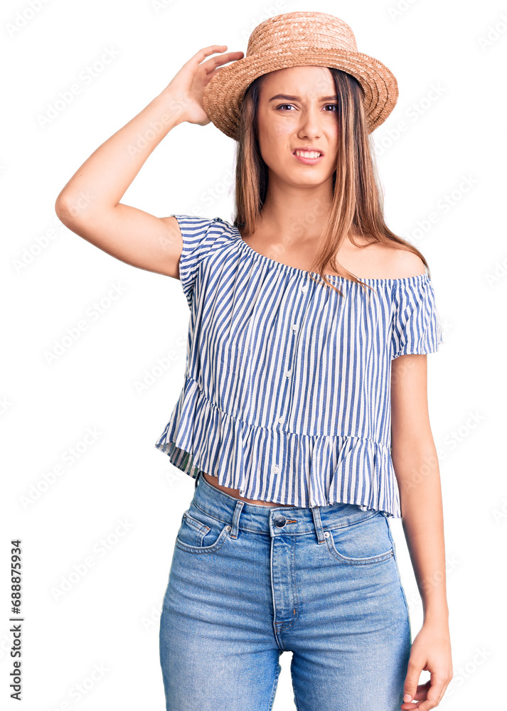 Young beautiful girl wearing hat and t shirt confuse and wonder about question. uncertain with doubt, thinking with hand on head. pensive concept. Young beautiful girl wearing hat and t shirt confuse and wonder about question. uncertain with doubt, thinking with hand on head. pensive concept.