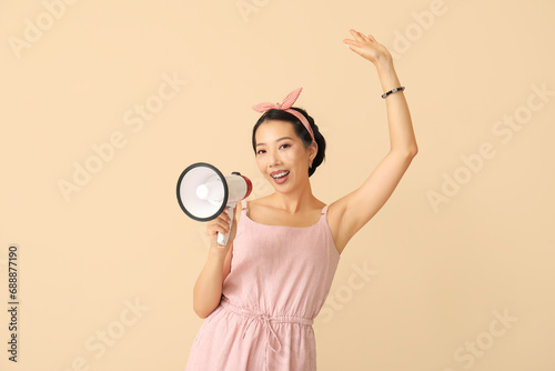 Young Asian woman with mega...