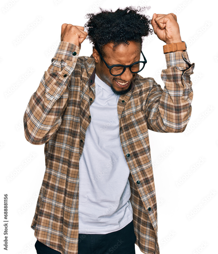 Φωτογραφία Young african american man with beard wearing casual clothes and glasses excited for success with arms raised and eyes closed celebrating victory smiling