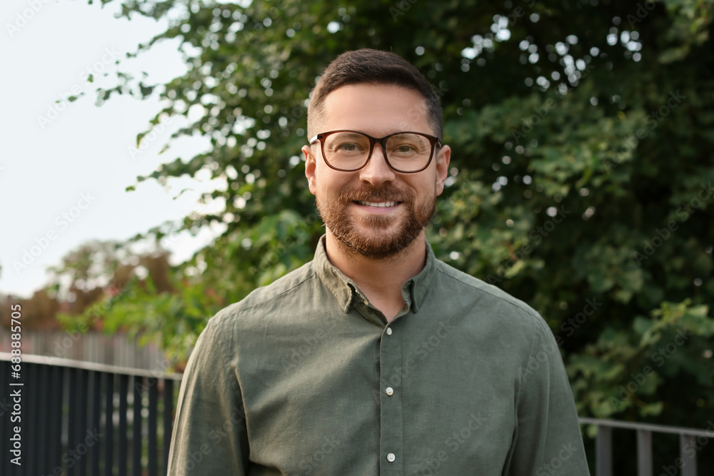 Portrait of handsome bearded man in glasses outdoors Portrait of handsome bearded man in glasses outdoors