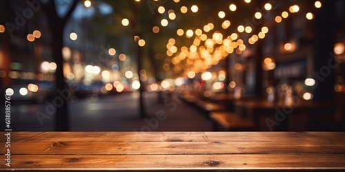 Empty wooden table with a blurred cityscape at night in the background. Suitable for product display and advertising backdrops.
