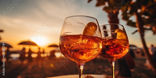 Friends toasting iced drinks at a beach sunset.  Great for travel, friendship, and lifestyle promotional material.