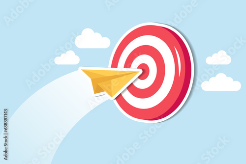 Business goal or target, challenge or improvement to achieve success, win business competition or motivation concept, paper plane origami flying through dartboard or archer bullseye target.