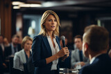 young businesswoman giving a speech in a conference room