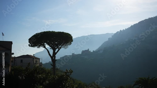 Cinematic view of famous Amalfi Coast with Gulf of Salerno from Villa Cimbrone Gardens in Ravello, Campania, Italy, summer sunny day with cloudy sky. Concept of vacations and travel in Europe photo