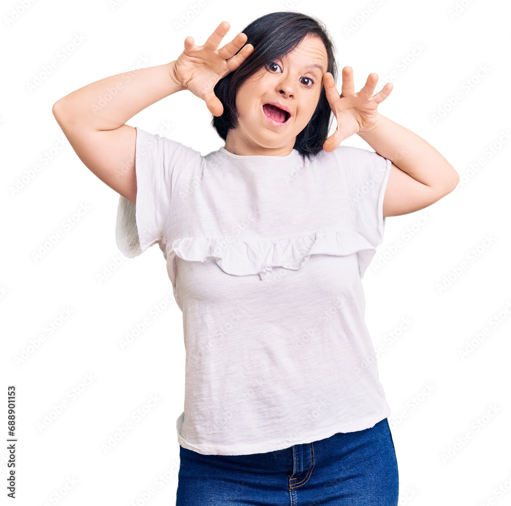 Brunette woman with down syndrome wearing casual white tshirt smiling cheerful playing peek a boo with hands showing face. surprised and exited Brunette woman with down syndrome wearing casual white tshirt smiling cheerful playing peek a boo with hands showing face. surprised and exited