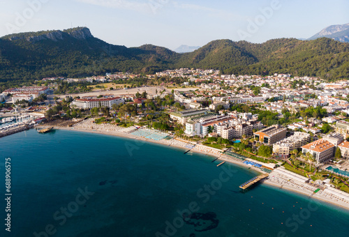 Aerial photo of Kemer, seaside town in Turkey on Mediterranean coast, with view of Taurus Mountains in background.