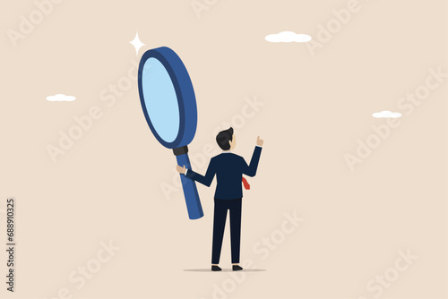 Search, discover, research, report analysis or specialist investigation for insight information concept, smart businessman using magnifying glass investigating business information.
