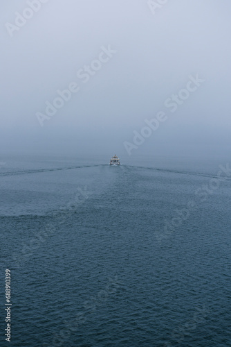  boat in the sea on the mist morning