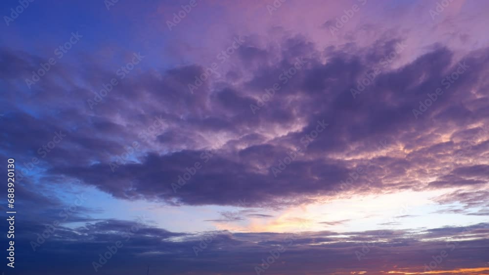 4K : Sunset sky timelapse, The sky's canvas ignites in a burst of oranges and pinks, while billowing clouds rush by in a breathtaking time-lapse spectacle. Summer sky background. Nature concept.
4K : Sunset sky timelapse, The sky's canvas ignites in a burst of oranges and pinks, while billowing clouds rush by in a breathtaking time-lapse spectacle. Summer sky background. Nature concept.