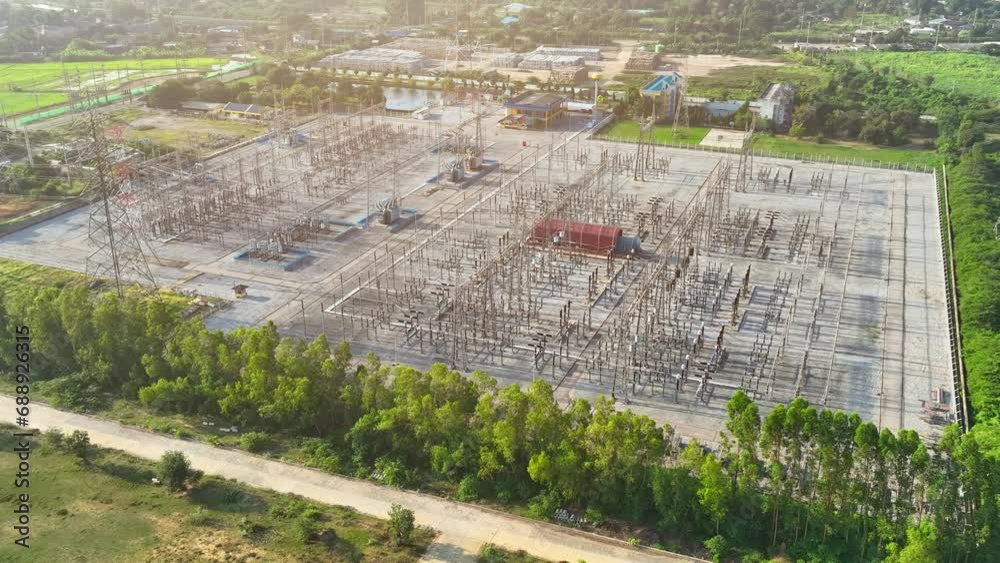 From a bird's-eye perspective, an electrical substation forms a mesmerizing geometric pattern, where wires and transformers create a symphony of electricity.
From a bird's-eye perspective, an electrical substation forms a mesmerizing geometric pattern, where wires and transformers create a symphony of electricity.