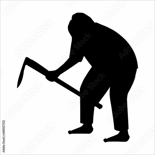 Silhouette of a person hoeing photo