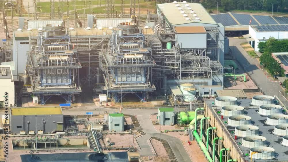A state-of-the-art power plant, utilizing cutting-edge technology, generates electricity efficiently and sustainably, supporting industrial operations. Bird's eye view by drone.
A state-of-the-art power plant, utilizing cutting-edge technology, generates electricity efficiently and sustainably, supporting industrial operations. Bird's eye view by drone.