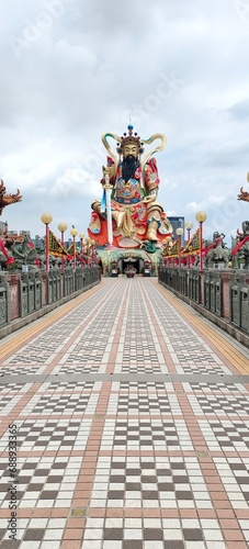 Zuoying Yuandi Temple at Lotus Pond in Zuoying district,Kaohsiung City, TaiwanThe Xiangtiang God tramps a snake with his foot and carries a sword by hand.  photo