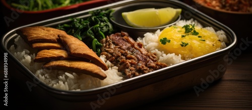 Traditional Brazilian food served in the marmitex, also known as the authentic Brazilian lunchbox.