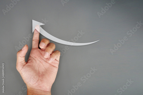 Hand drawing rising arrow on a background. Business growth and success concept. a sign of financial and economic success.