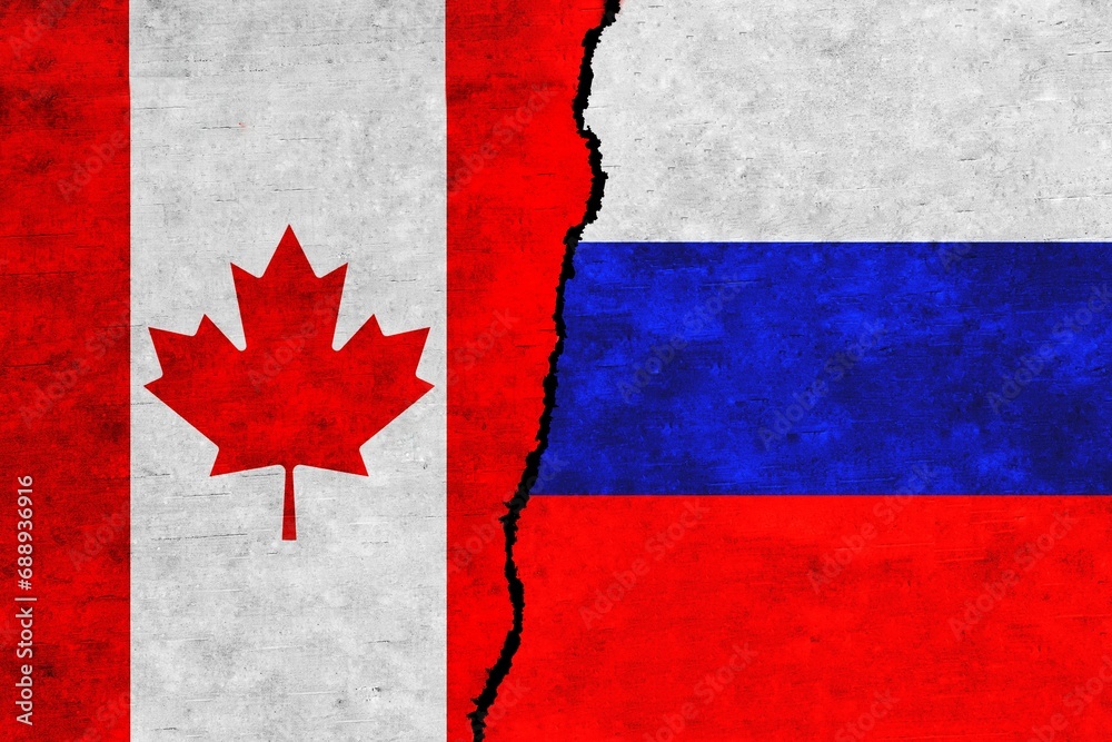 Russia and Canada painted flags on a wall with a crack. Russia and Canada relations. Canada and Russia flags together
