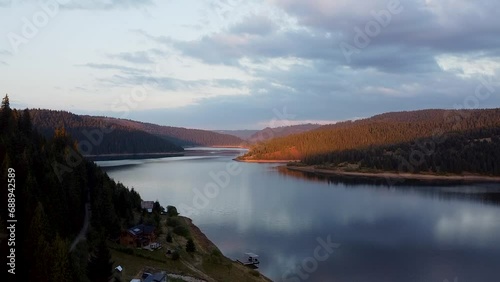 flying the drone over the lake at sunset photo