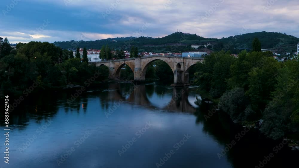 Iconic raised Roman bridge of ourense, galicia, spain at blue hour or dusk Iconic raised Roman bridge of ourense, galicia, spain at blue hour or dusk