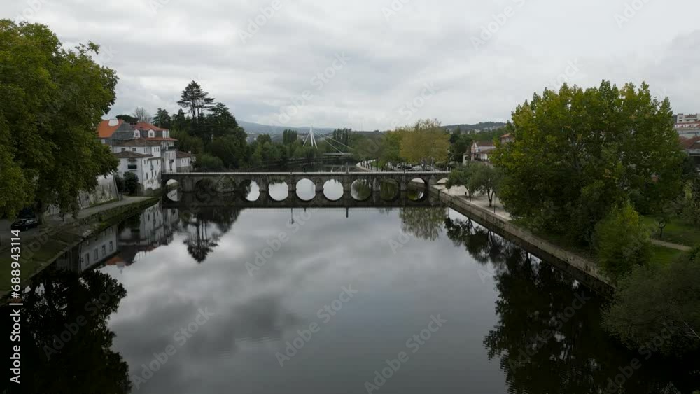High drone dolly push in to roman bridge of Aquae Flaviae, Chaves Vila Real Portugal on cloudy day High drone dolly push in to roman bridge of Aquae Flaviae, Chaves Vila Real Portugal on cloudy day