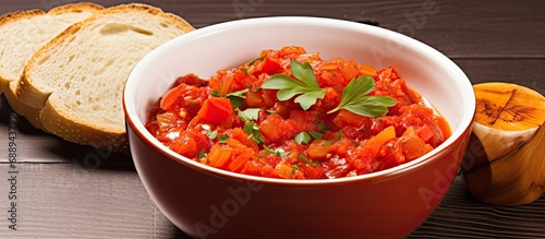Spanish vegetable sauce made with tomatoes, peppers, garlic, almonds, oil, and bread. Located immediately above. photo