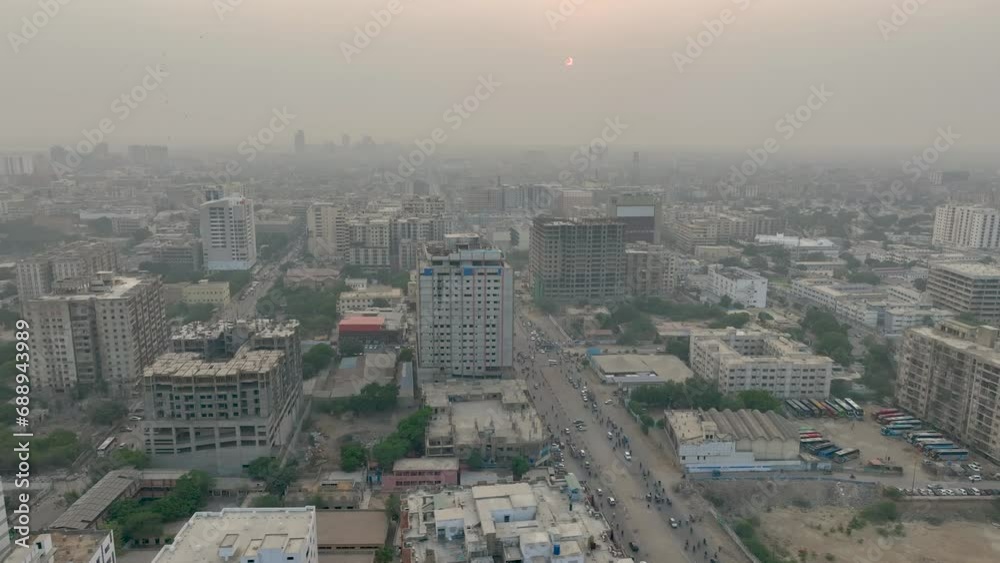 Aerial drone panning shot from left to right over heavy traffic along MA Jinnah road, Karachi, Pakistan during evening time. Aerial drone panning shot from left to right over heavy traffic along MA Jinnah road, Karachi, Pakistan during evening time.