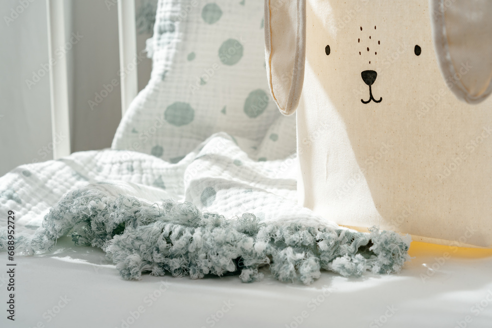 Rabbit basket for toys and blanket in baby bed Rabbit basket for toys and blanket in baby bed