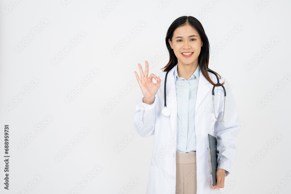 A confident female doctor, showing OK hand sign, looking confident at camera, white background A confident female doctor, showing OK hand sign, looking confident at camera, white background
