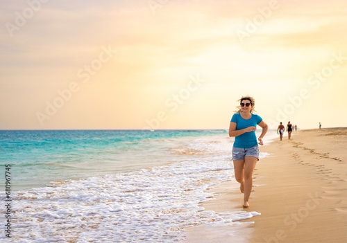 Beautiful woman running on sunny beach Santa Maria, Sal Island, Cape Verde  © Jacek Chabraszewski