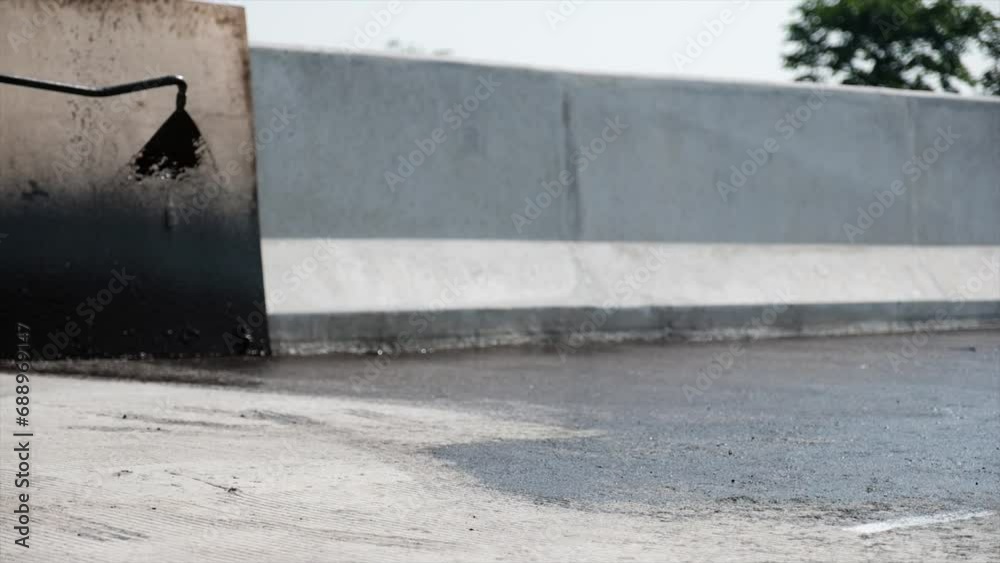 Process of asphalting road construction infrastructure by spraying or casting prime coat, tack coat or gluing the ATB layer with hot mix asphalt. Toll road asphalting