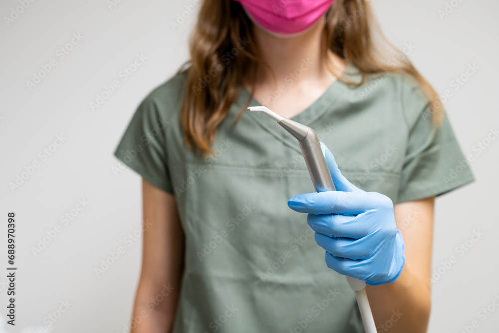 Dental brush in dentist hands in rubber gloves. Dental brush in dentist hands in rubber gloves.